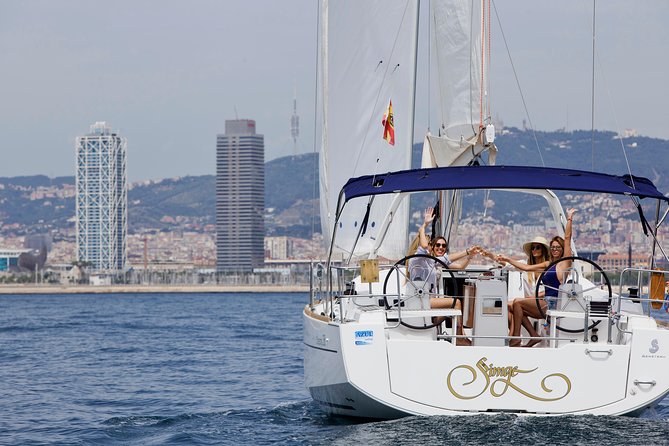1h Refreshing Sailing Tour in Barcelona with Open Bar & Snacks - What’s included on board: the open bar, snacks, and comfort basics