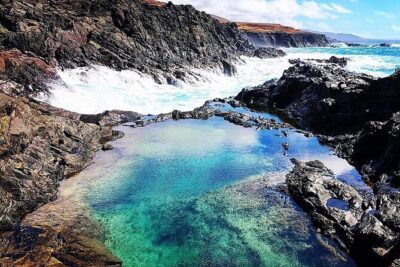 7-Hour Private Tour to the Wonders of Fuerteventura - Entering El Cotillo: coves, cliffs, and that laid-back fishing-village vibe
