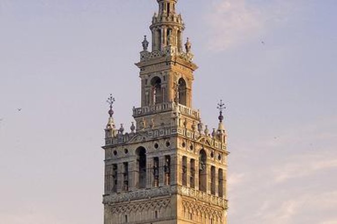Alcazar, Cathedral, Santa Cruz Quarter, Bullring and River Cruise Tour in Seville - Santa Cruz Quarter: Pretty Streets Plus Helpful Orientation
