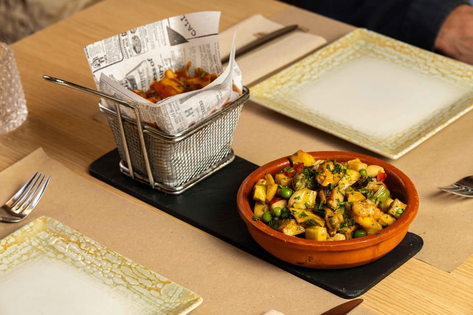 Alcudia: Self-Guided Gourmet Tapas and Wine Tour - What the Old Town strolling feels like between stops