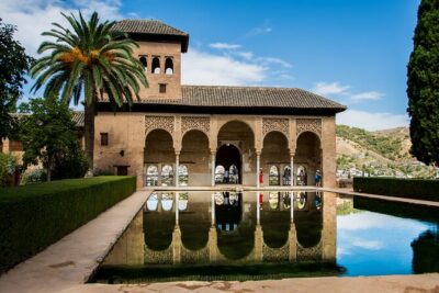 Alhambra Tour and Nazaries Palaces with Hammam Massage Experience - Entering the Alhambra complex the way it’s meant to be seen