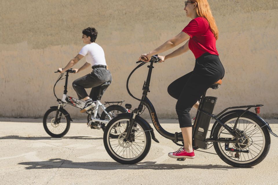 All Madrid: Private Electric Bike Tour around the city - Calle Cuchilleros and Factor Street: food street energy and a cathedral viewpoint