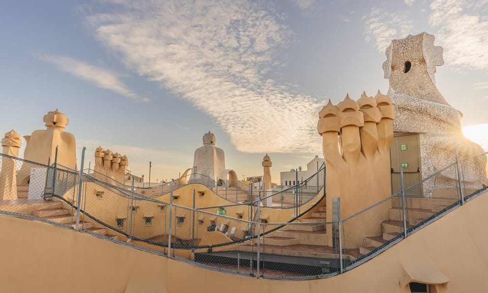 Barcelona: Casa Batlló, Casa Milà & Casa Vicens Guided Tour - Casa Milà (La Pedrera): the stone facade, seaweed railings, and a living neighborhood