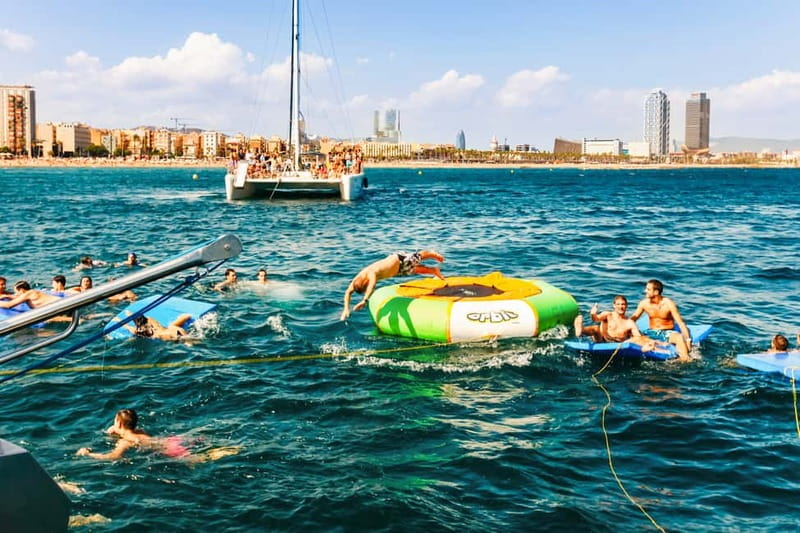 Barcelona: Catamaran Party Cruise with BBQ Meal - The outbound sailing: your first hour of music and sea air