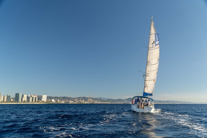 Barcelona Coastal Sailing (Open Bar, Catalan Snack & Swim Stop) - Sunset cruise toward Tibidabo and Barcelona lights