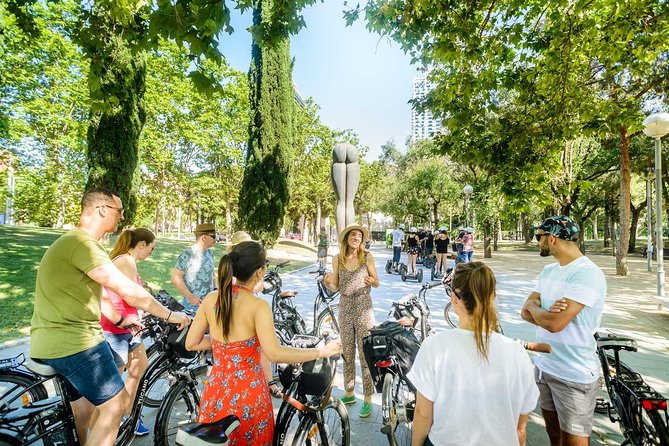 Barcelona E-Bike Small Group Tour with Tapas & Wine Tasting - Harbor time: Port Olímpic, Barceloneta, Port Vell, and the Columbus view