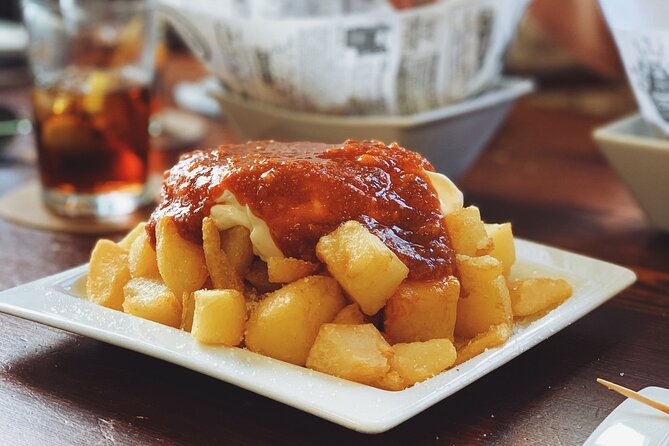 Barcelona Food Tour: Tapas, Drinks and Delights with a Local - Stop 2: Carrer de la Mercè and a Wine Pairing with Anchovies