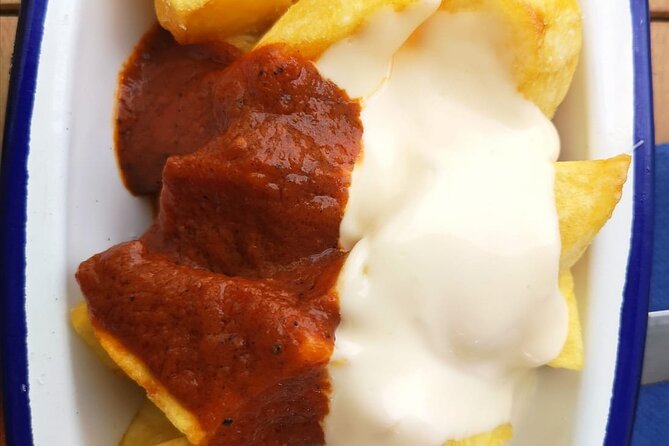 Barcelona Food Tour: Tapas, Drinks and Delights with a Local - Stop 3: Carrer del Regomir with Cava and Classic Bar Snacks