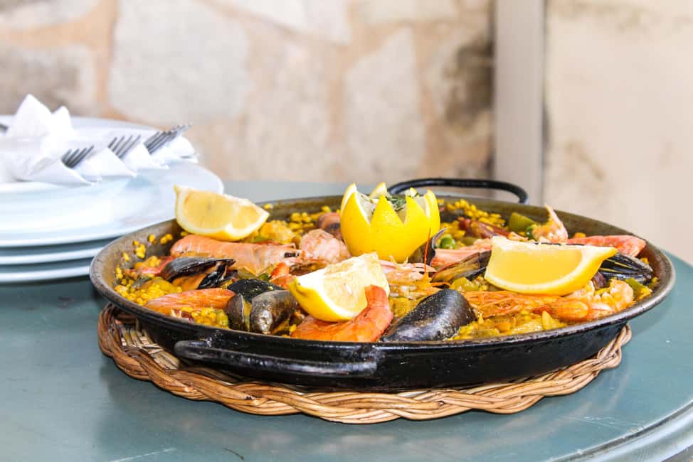 Barcelona: Old Town Tapas & Paella Food Tour with 8 Tastings - The Market Lesson: Iberian Ham, Cheeses, and Seasonal Produce
