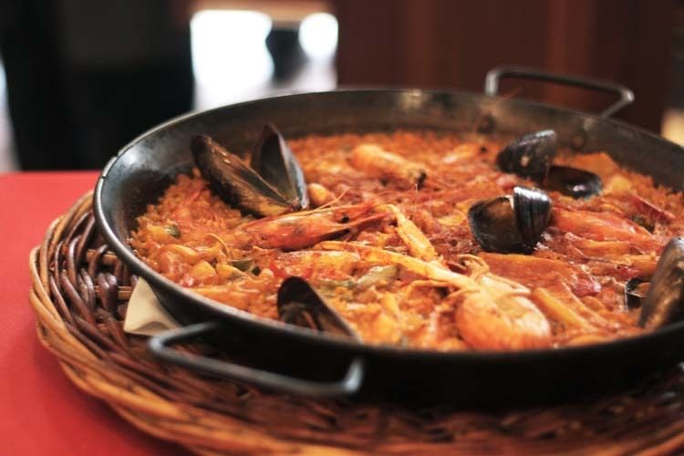 Barcelona: Old Town Tapas & Paella Food Tour with 8 Tastings - Tapas at a Family-Run Restaurant with Wine Pairings