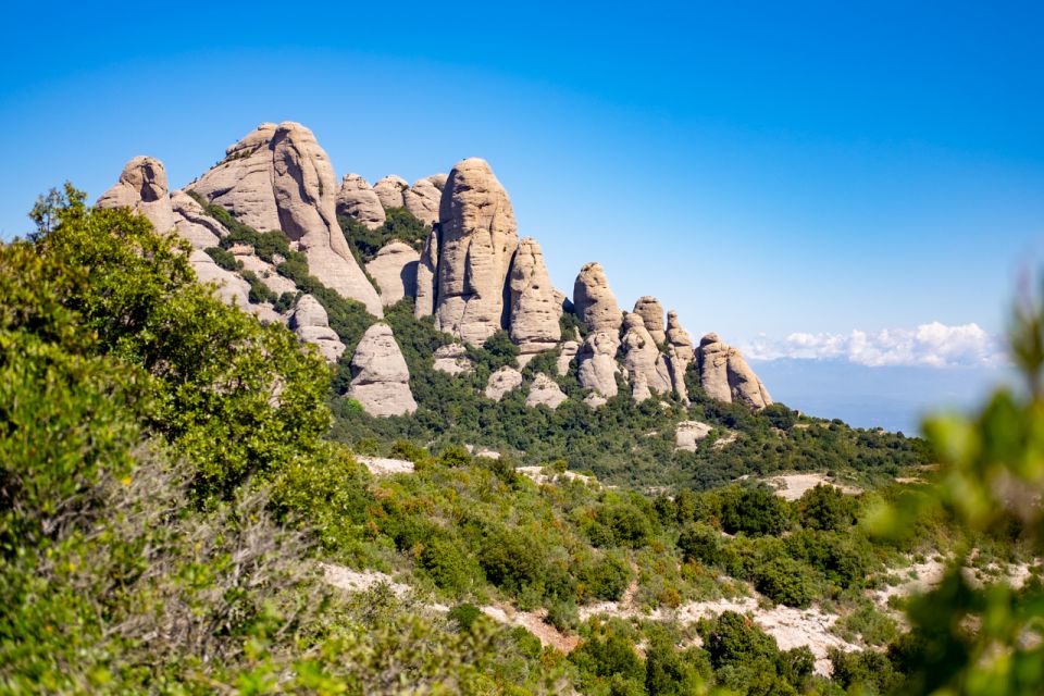 Barcelona: Sitges & Montserrat Monastery Tour with Easy Hike - Guided Visits Inside the Montserrat Monastery: Basilica, Atrium, and Cloister Views