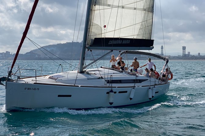 Barcelona Small Group Sailing with Snacks and Cava - Barceloneta Beach and the Mediterranean swim break