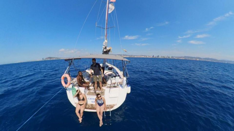 Barcelona: Sunset Sailing Experience with Snacks and Cava - The highlight moment: jumping into Barcelona’s clear waters