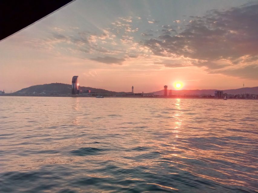 Barcelona: Sunset Sailing Tour with Open Bar & Snacks - Sailing out: skyline views that change every 5 minutes