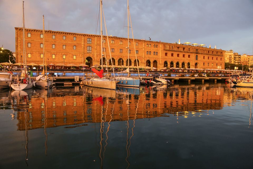 Barcelona: Unique Sunset Sailing Tour with Tapas & Open Bar - Comfort tips: what to wear and how to enjoy the sea air