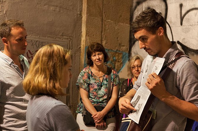 Barcelona's Dark History Night Tour - How the guide makes it work at night: radioguides, projector, and props