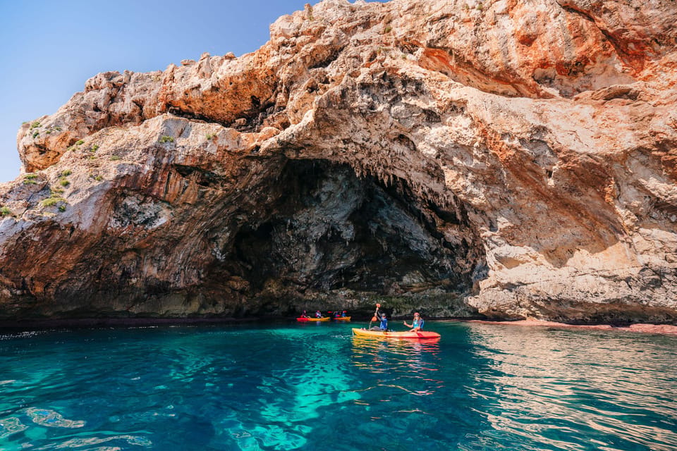 Cala Varques: Guided Sea Caves Kayak & Snorkeling Expedition - Caves and legends: Cova des Coloms, Falco cave, pirate caves, and arches