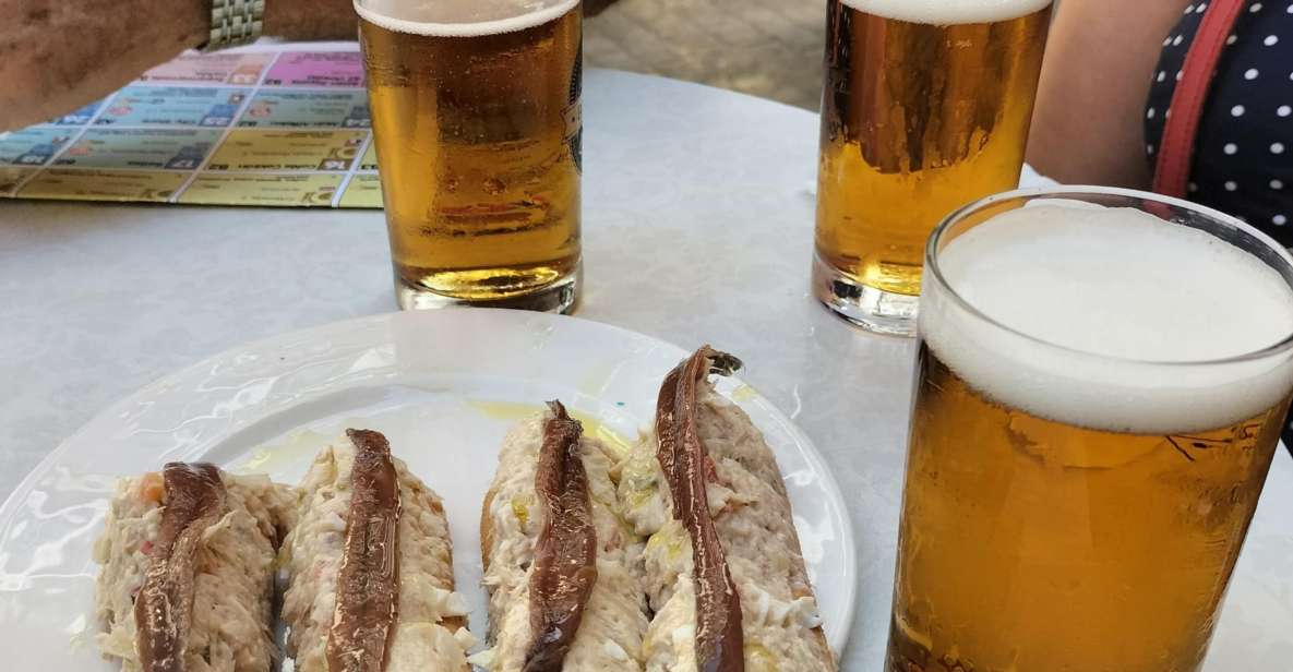 Cartagena: Guided Walking Tour with Tapas and Drinks - Consistorial Palace and Calle Mayor: Where Architecture Meets Stories