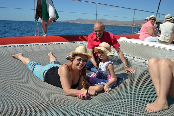 Catamaran Half-Day Cruise from Caleta de Fuste - Lunch and dessert on the water: paella or salad, with drinks flowing