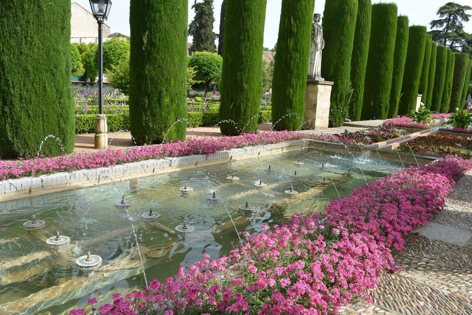 Cordóba: Gardens & Fortress of Catholic Monarchs Guided Tour - The Fortress of Catholic Monarchs: From Royal Residence to Prison-Era Power