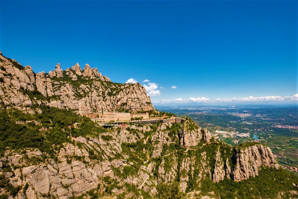 From Barcelona: Montserrat Monastery, Easy Hike, Cable Car - The monastery visit: cloister, chapel atmosphere, and smart guiding