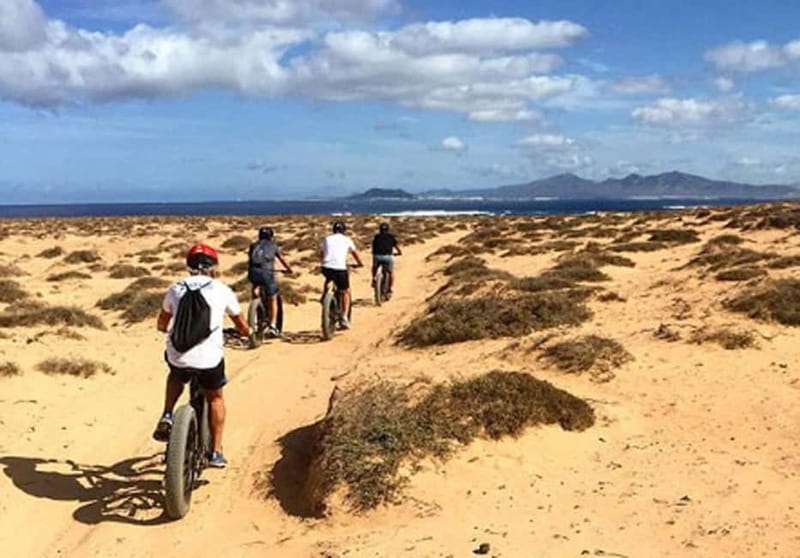 From Corralejo: Fuerteventura Guided E-Bike/E-scooter Tour - North Volcanic Chain: Bayuyo and Calderon Hondo craters