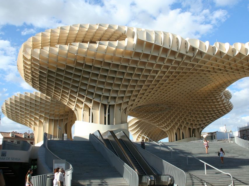 From Costa del Sol: Seville Day Trip - Walking the river side with bridges and landmarks