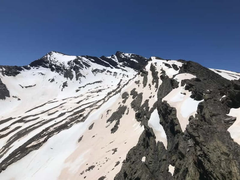 From Granada: High Sierra Nevada hiking experience - Tajos del Campanario viewpoint: staring up at Mulhacén’s north face