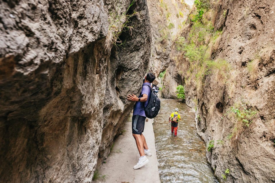 Granada: Los Cahorros de Monachil Canyon Hiking Tour - Los Cahorros in motion: tunnel, narrow paths, and crouching sections