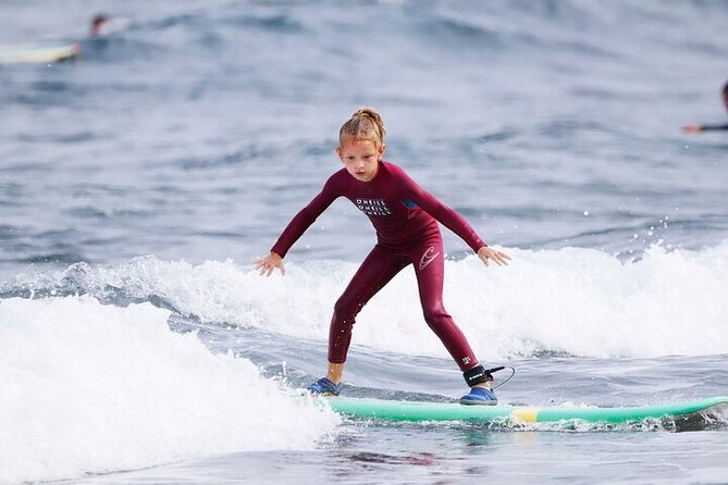 Group Surf Class in Playa de Las Américas with Photographs - Warm-up to first waves: how they help you get oriented fast