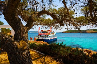 Ibiza: Beach Hopping Cruise w/ Paddleboard, Food, & Drinks - Where You Meet: Float Your Boat Kiosk in San Antonio