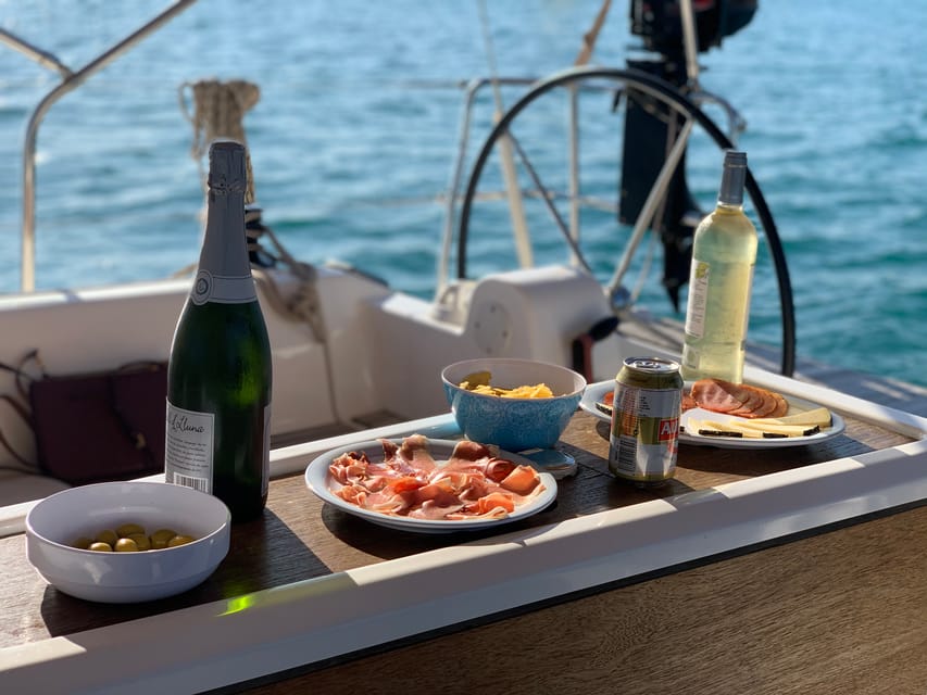 Ibiza: Midday or Sunset Sailing with Snacks and Open Bar - The Coastline From 360° Views: Bays, Landmarks, and Photo Angles