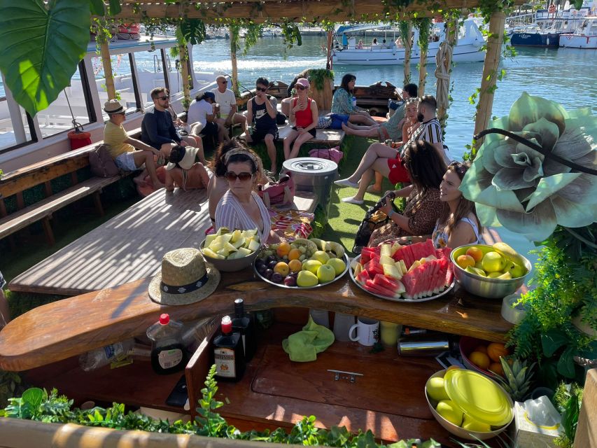 Ibiza: Sea Caves & Coves Snorkeling Paddle Boarding Tour - The Amazonia Boat: Jungle Themes, a Solid-Wood Bar, and Space to Chill