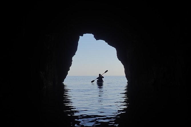 Kayak and snorkel excursion to Cova Tallada - At sea first: your kayak history stop and why it sets the tone