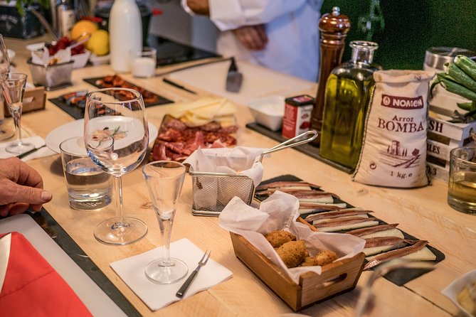La Boqueria Market and Paella Cooking Class in Barcelona - Dining in a renovated 18th-century apartment
