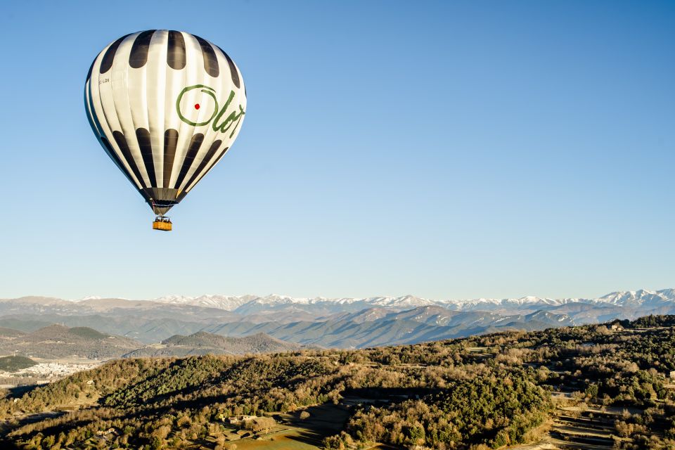 La Garrotxa Volcanoes Half-Day Hot Air Balloon Flight - In the air over craters, forests, and cliff-top villages