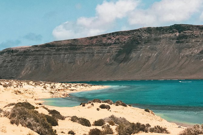 Lanzarote: La Graciosa island cruise with lunch and water activities - Drinks and Food: Sangria, Beer, and Traditional Paella