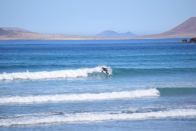 Lanzarote Surfing Session - Theory, Warm-up, and the First Waves: The Coaching Style That Helps