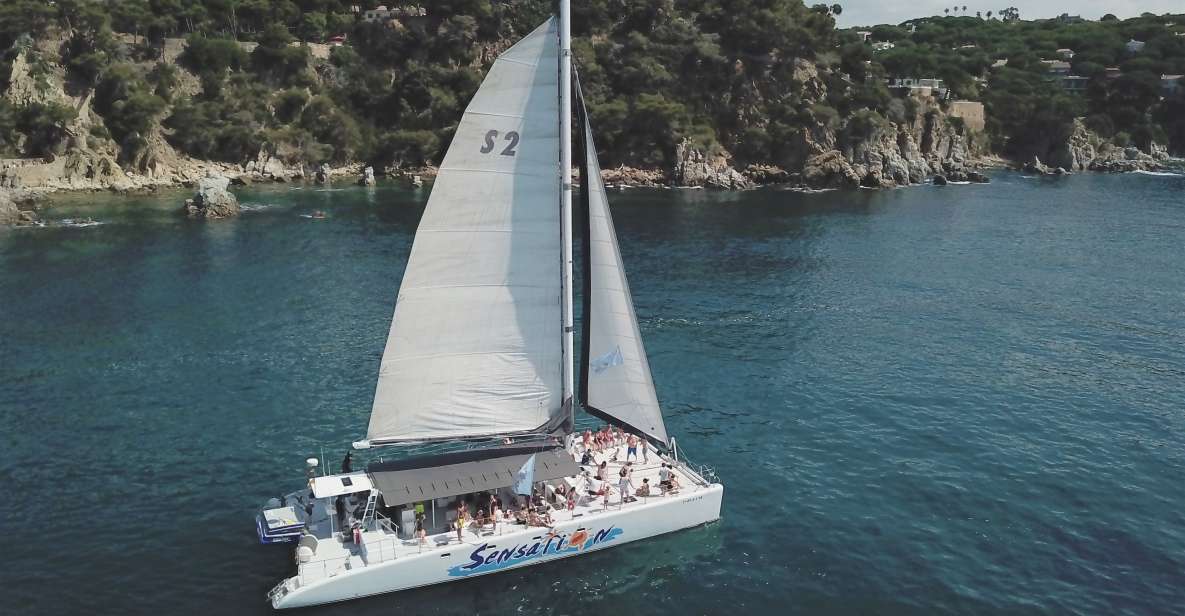 Lloret de Mar: Sunset Catamaran Cruise with DJ and Drinks - Why Lloret de Mar sunset + a catamaran feels like the right combo