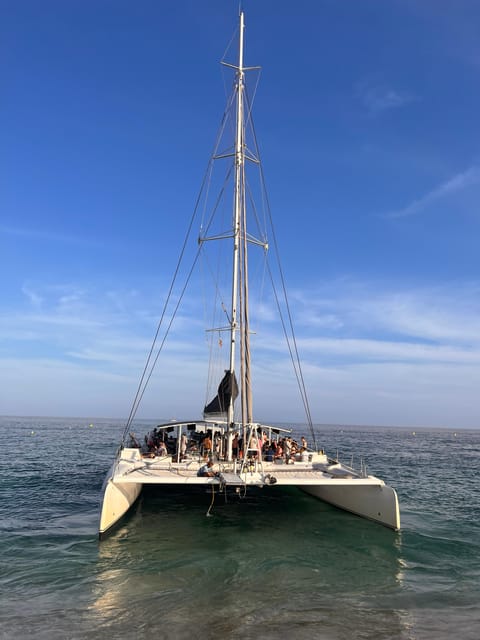 Lloret de Mar: Sunset Catamaran Cruise with DJ and Drinks - Getting On Board: Passeig dAgustí Font and the 30-minute check-in