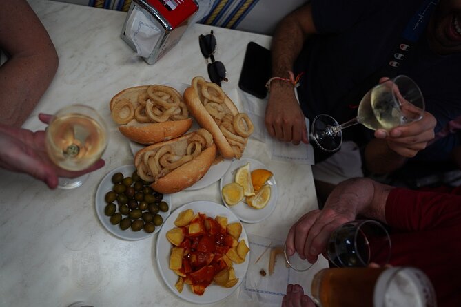 Madrid by Night: Tapas Crawl, Local Drinks & Hidden Gems - Plaza Mayor and the 1860 tavern: bocadillo de calamares and croquettes