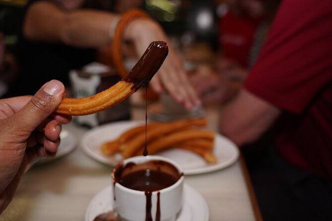 Madrid by Night: Tapas Crawl, Local Drinks & Hidden Gems - Puerta del Sol finale: shrimps, house wine, and local dessert