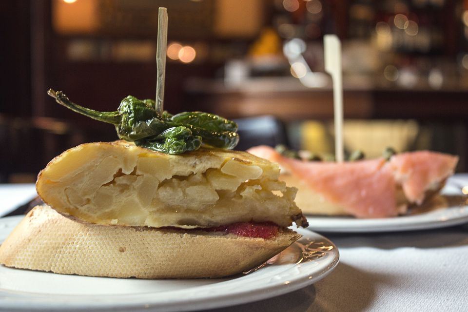 Madrid: Guided Food Tour with Authentic Tapas & Delicacies - Express route in 2 hours: century-old tavern to 170-year pastry shop