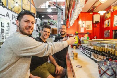 Madrid: Guided Food Tour with Authentic Tapas & Delicacies - First stop essentials: squid sandwich, tortilla, and bravas