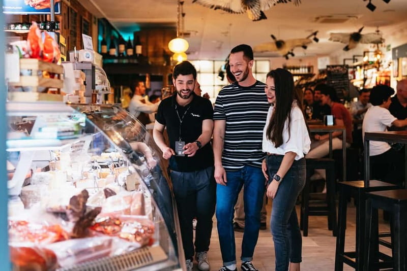 Madrid: Guided Tapas and Wine Tour with Rooftop Views - The garlic shrimp finish, plus clay-dish charm