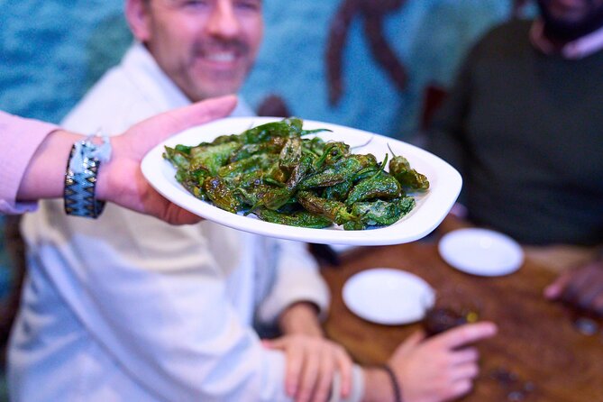 Madrid: Not Just Another Tapas & Wine Tour by Eating Europe - The food you’ll actually remember: ham carving, calamari sandwich, and a twist on rice
