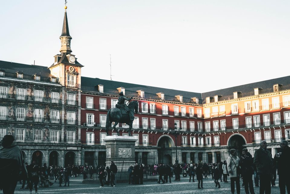 Madrid: Old Town & Poets District Guided Walking Tour - Plaza Mayor and the Arco de Cuchilleros: Big Square, Sharp Details