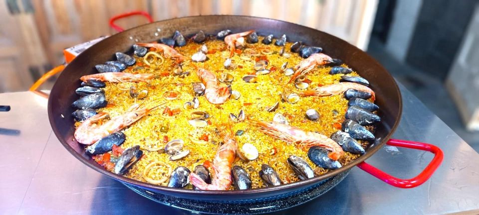 Madrid: Paella & Sangria Classes – Seafood, Chicken or Vegan - The sit-down finish: omelet, ham toast with tomato, and tapas in the middle