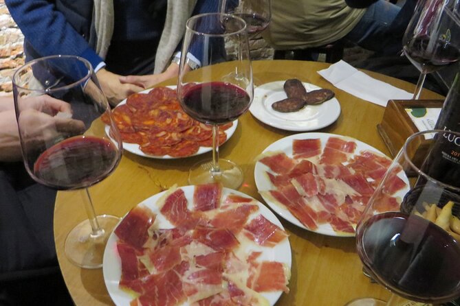 Madrid Small Group Tapas Tour at 4 Venues -Lunch or Dinner - The Main Square in Old Quarter: Iberian Ham and Wine Take Center Stage