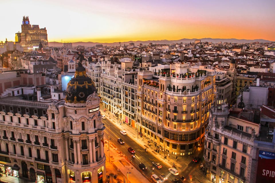 Madrid: Welcome to Madrid Guided Walking Tour in English - Plaza Mayor: from public spectacle to darker chapters